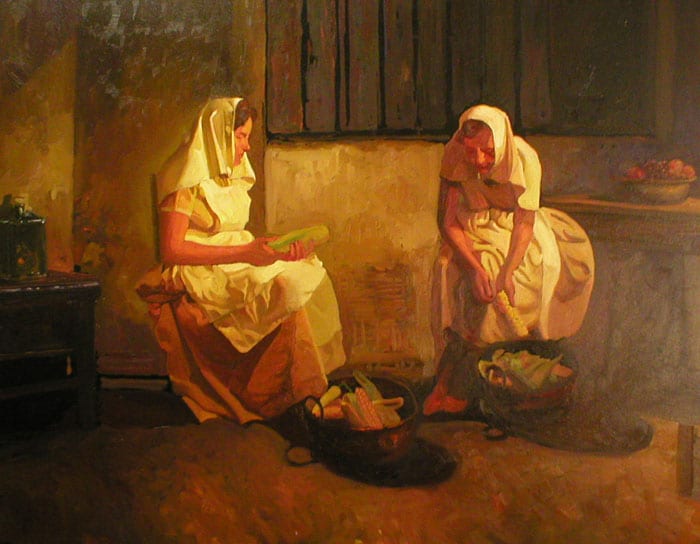 Mujeres pelando choclo